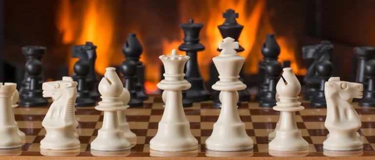 chess game by a fire